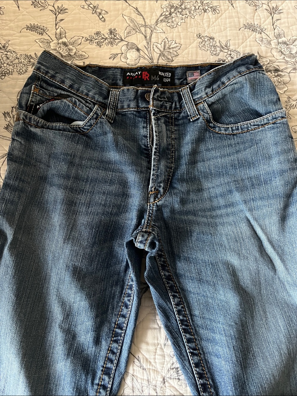 Ariat Men's FR M4 Relaxed boot cut blue jeans.